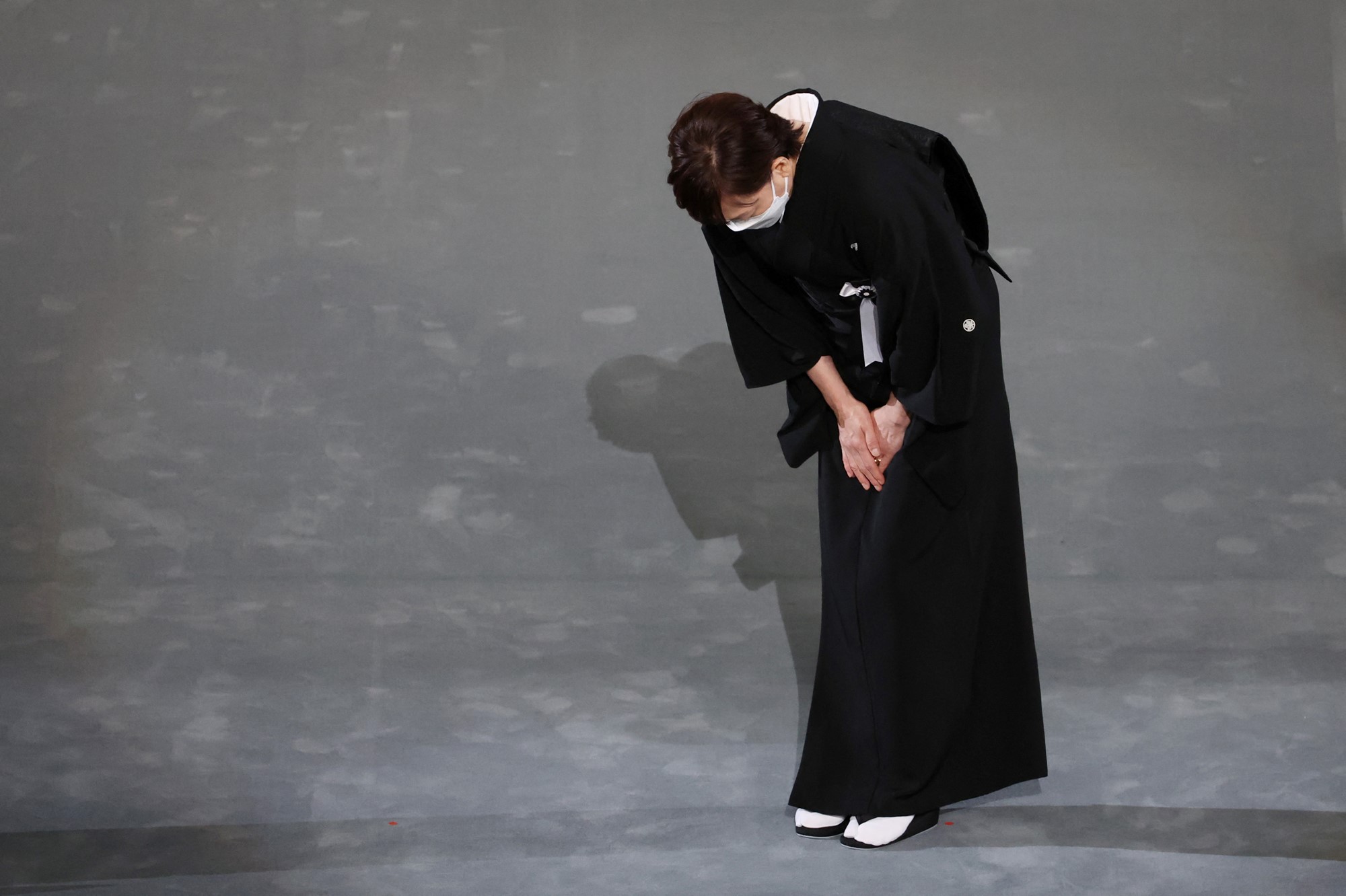 Widow of former Japanese prime minister Shinzo Abe, Akie Abe bows on stage during the state funeral for Japan's former prime minister Shinzo Abe on September 27, 2022