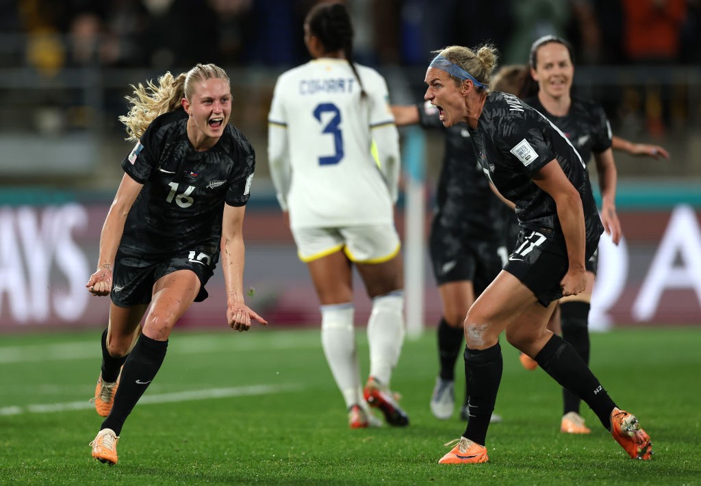 Jacqui Hand and Hannah Wilkinson shout after a goal for New Zealand in the Women's World Cup against Philippines.