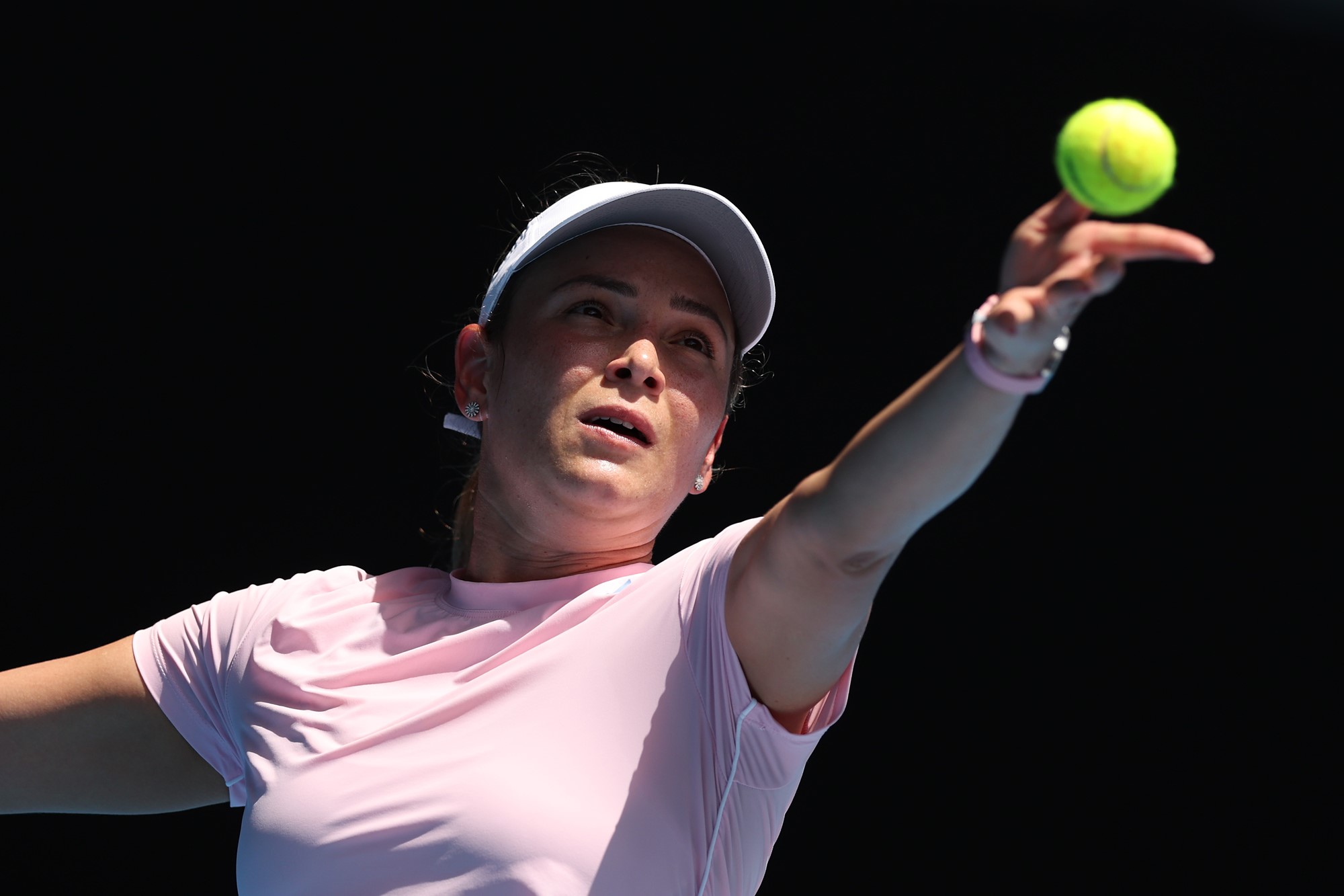 Donna Vekic serves the tennis ball.