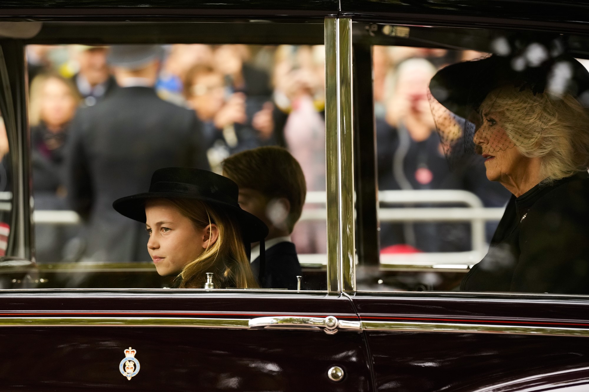 Princess Charlotte sits in the car, Queen Consort Camilla is in the back seat