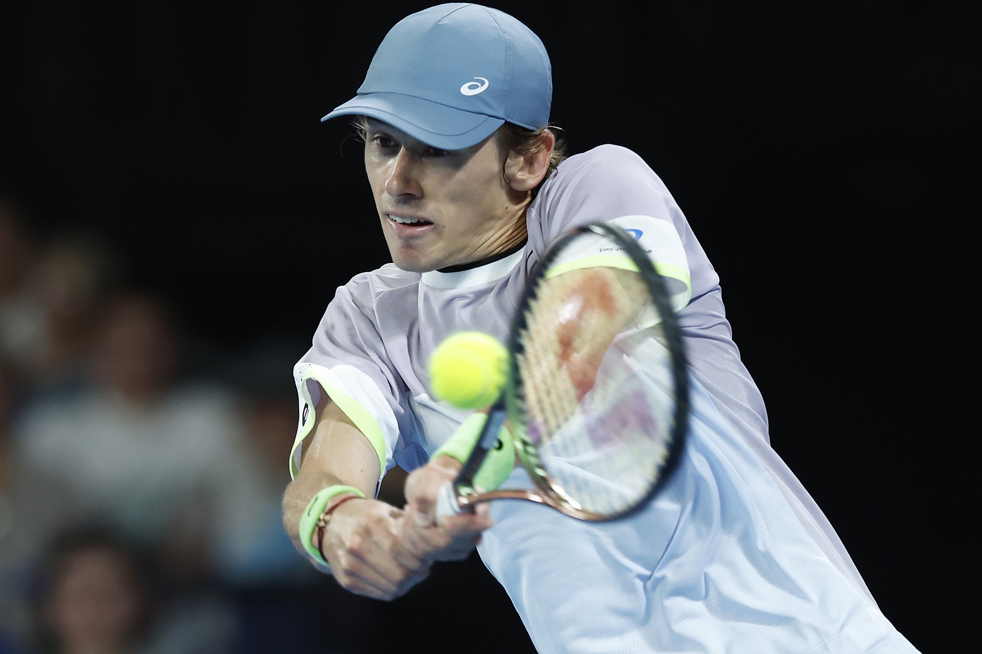 Alex De Minaur hits a backhand