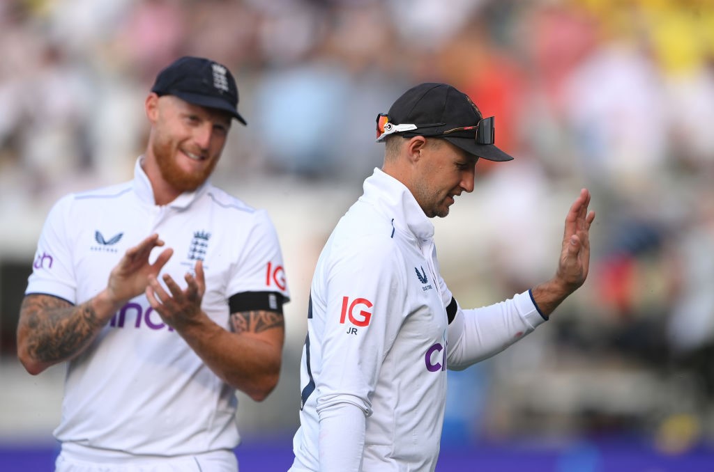 Joe Root waves and Ben Stokes claps as England leave the field on day one of the Ashes.