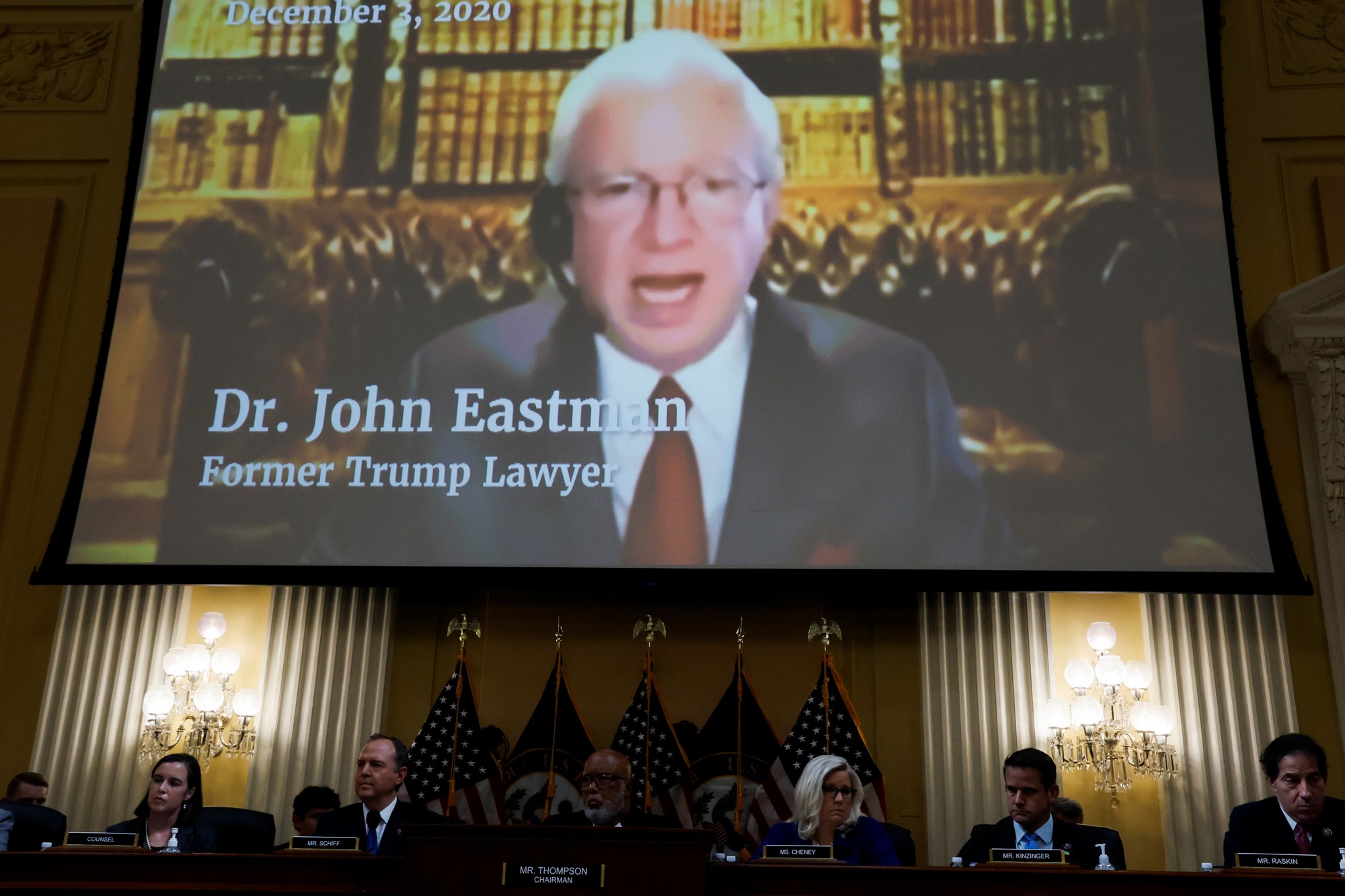 John Eastman, former attorney for former U.S. President Donald Trump, is seen speaking in a video displayed above during the fourth of eight planned public hearings