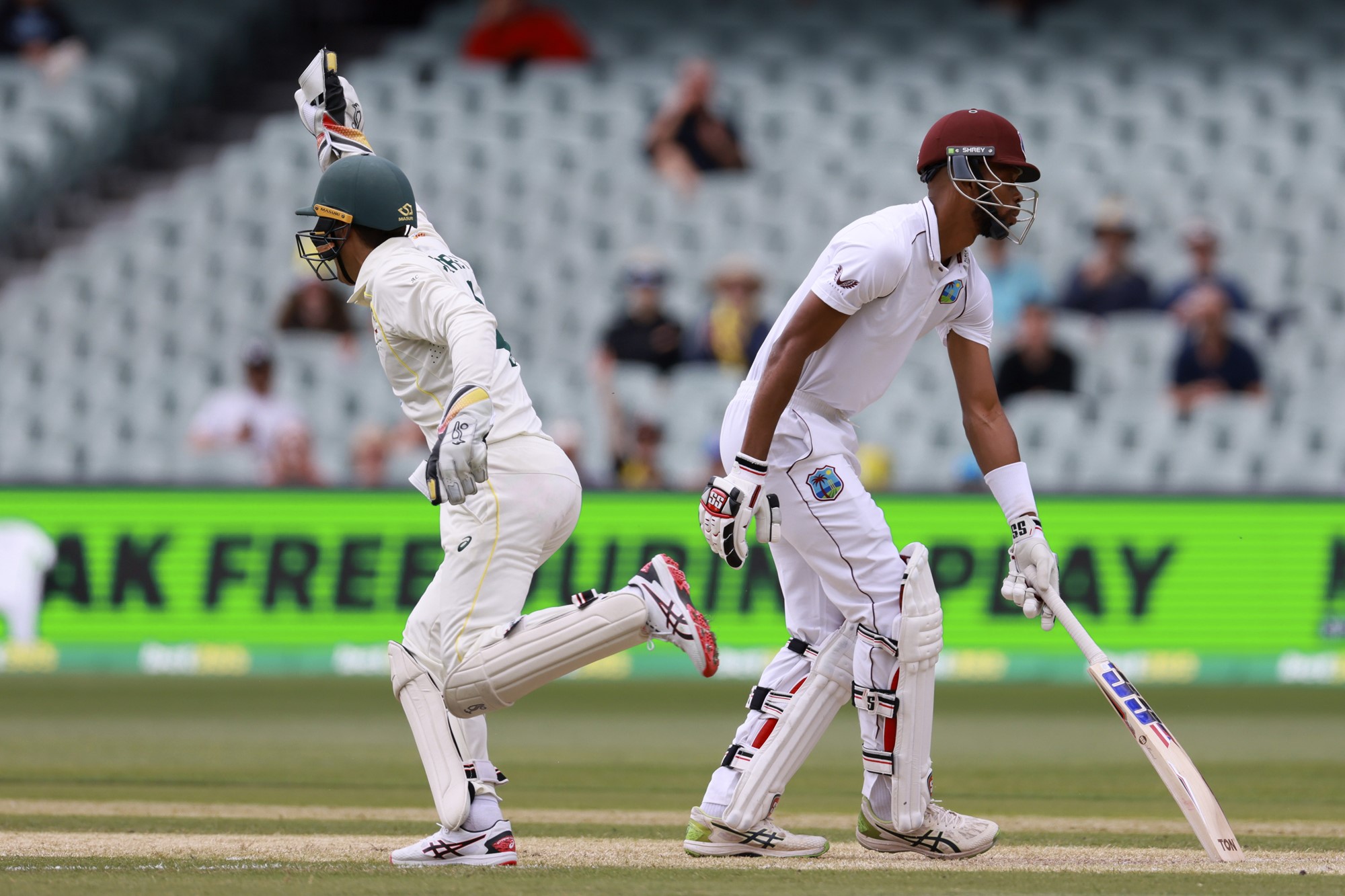 Alex Carey celebrates after catching out West indies' Roston Chase