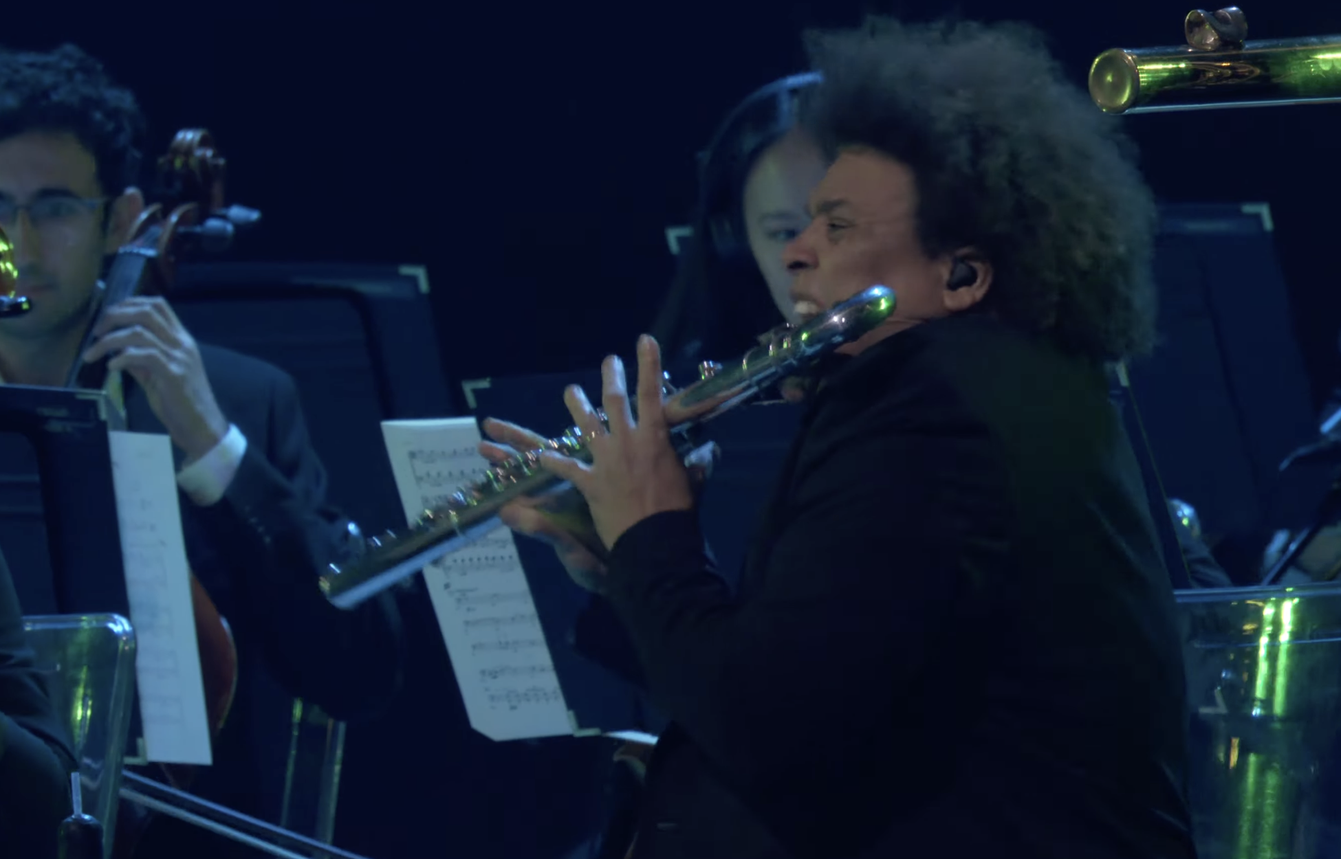 A man plays a flute at the Game Awards