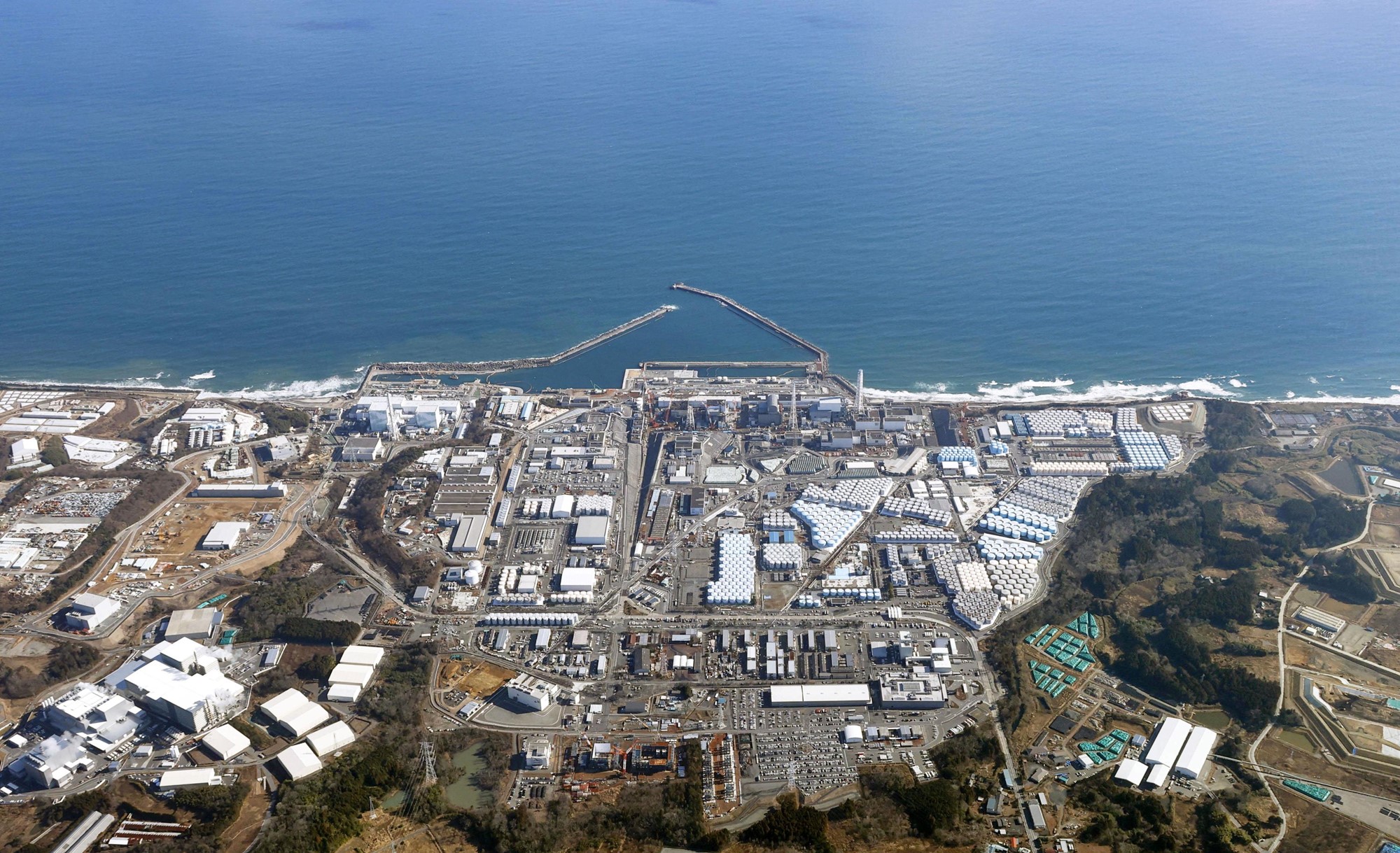 An aerial view shows the storage tanks for treated water at the tsunami-crippled Fukushima Daiichi nuclear power plant in Okuma town, Fukushima prefecture, Japan